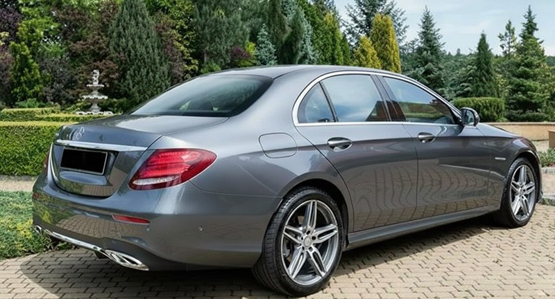 Grey Mercedes-Benz E-Class, rear three-quarter view