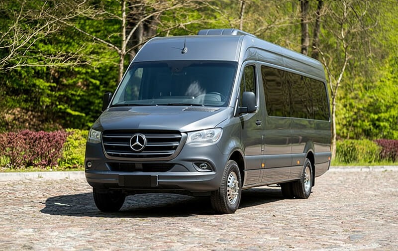 Grey Mercedes-Benz Sprinter minibus, front three-quarter view